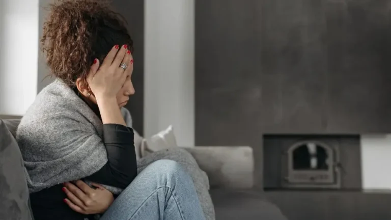 Woman suffering from a migraine during her period.