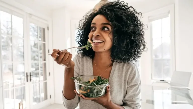 A woman feeling nourished while doing a liver cleanse